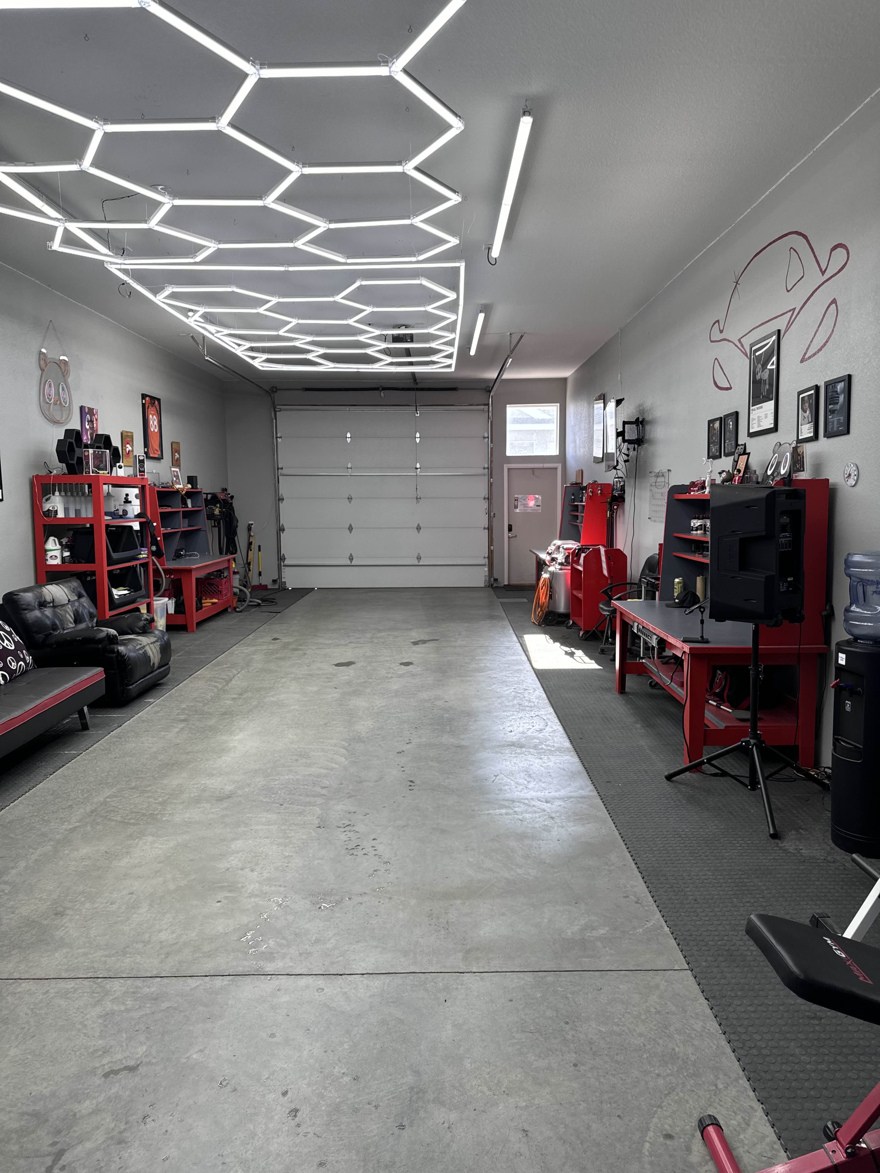 Full view of professional garage facility with hexagon lighting