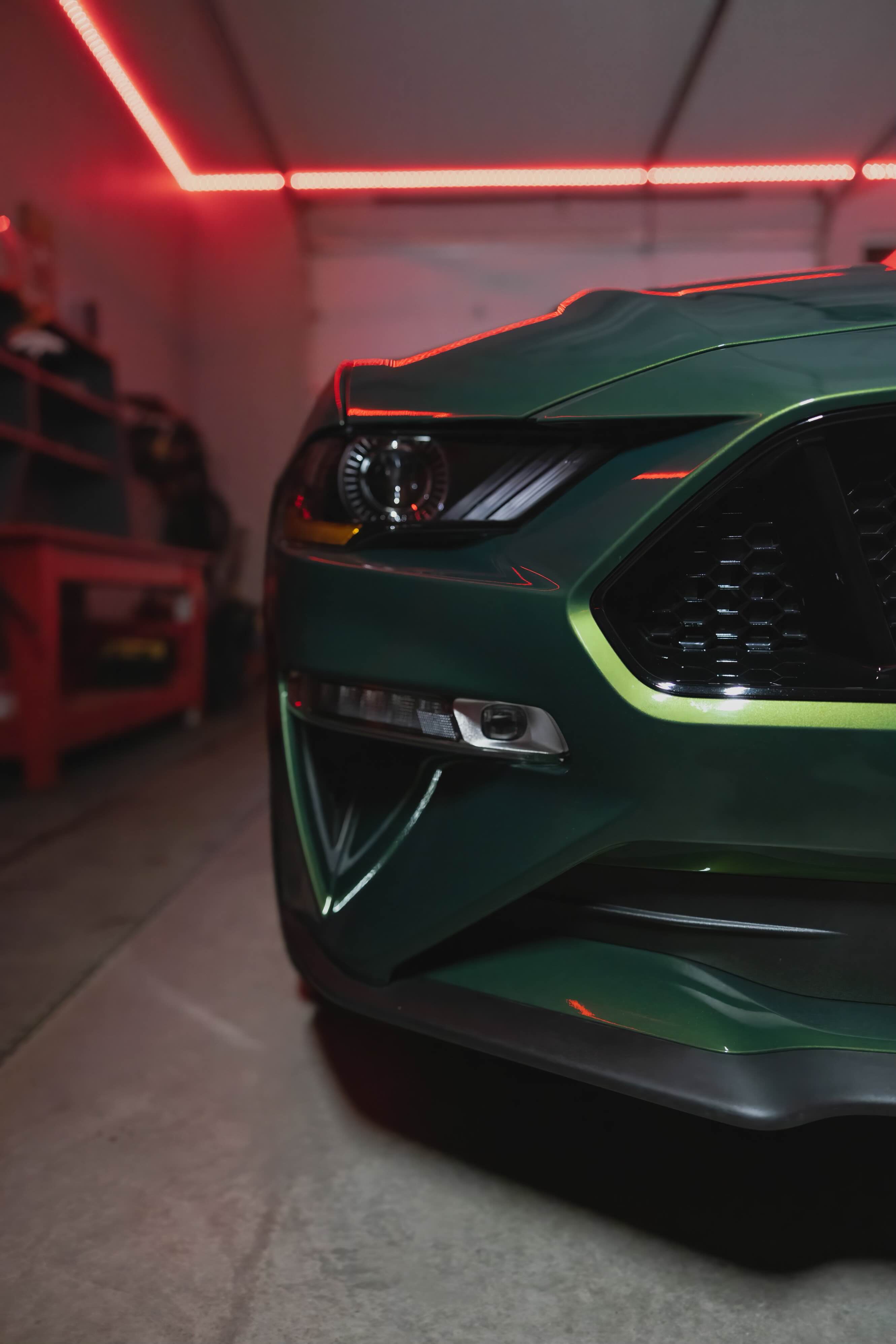 Green Mustang GT front closeup with red lighting
