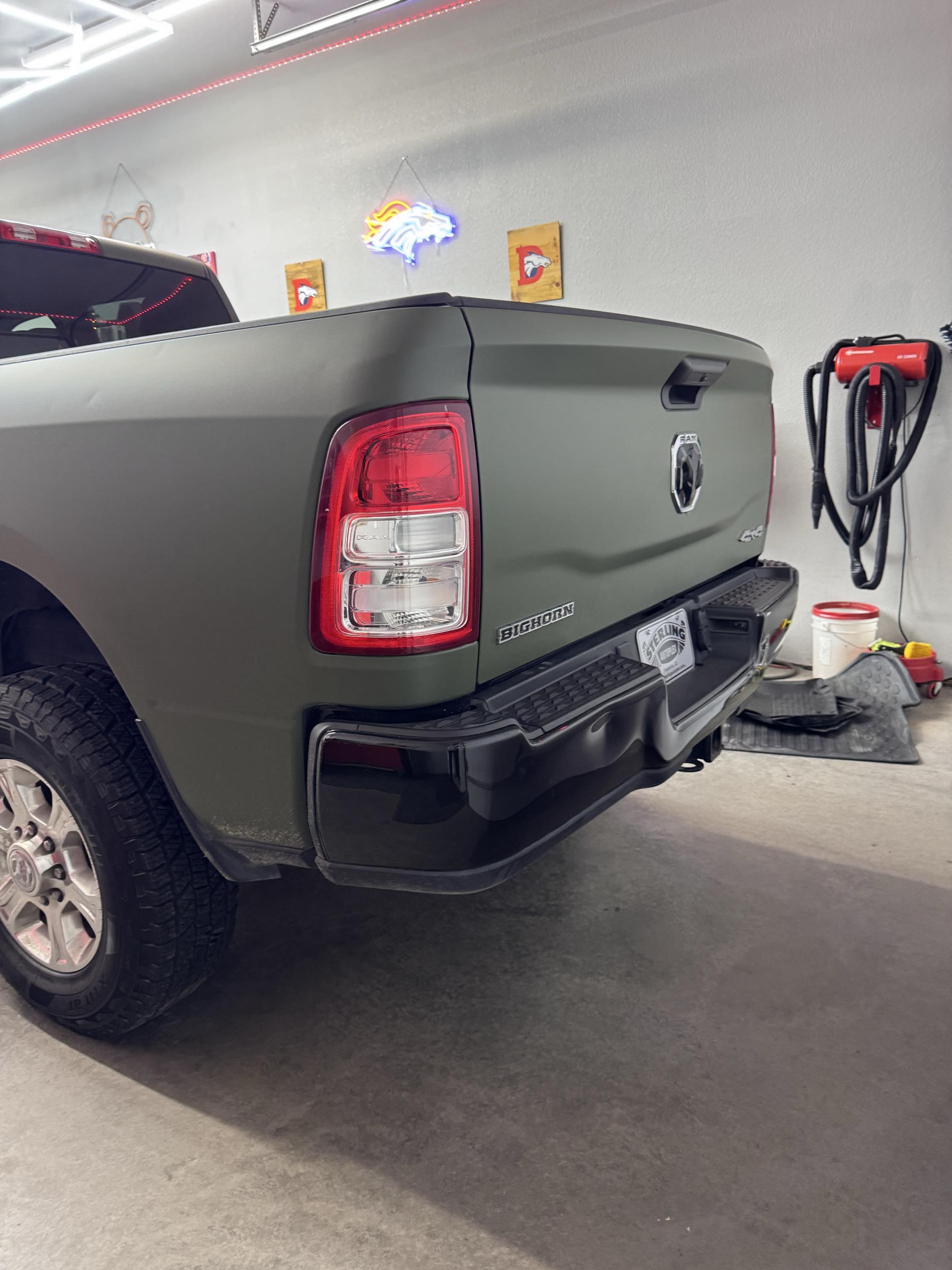 Rear view of olive green RAM Big Horn with ceramic coating