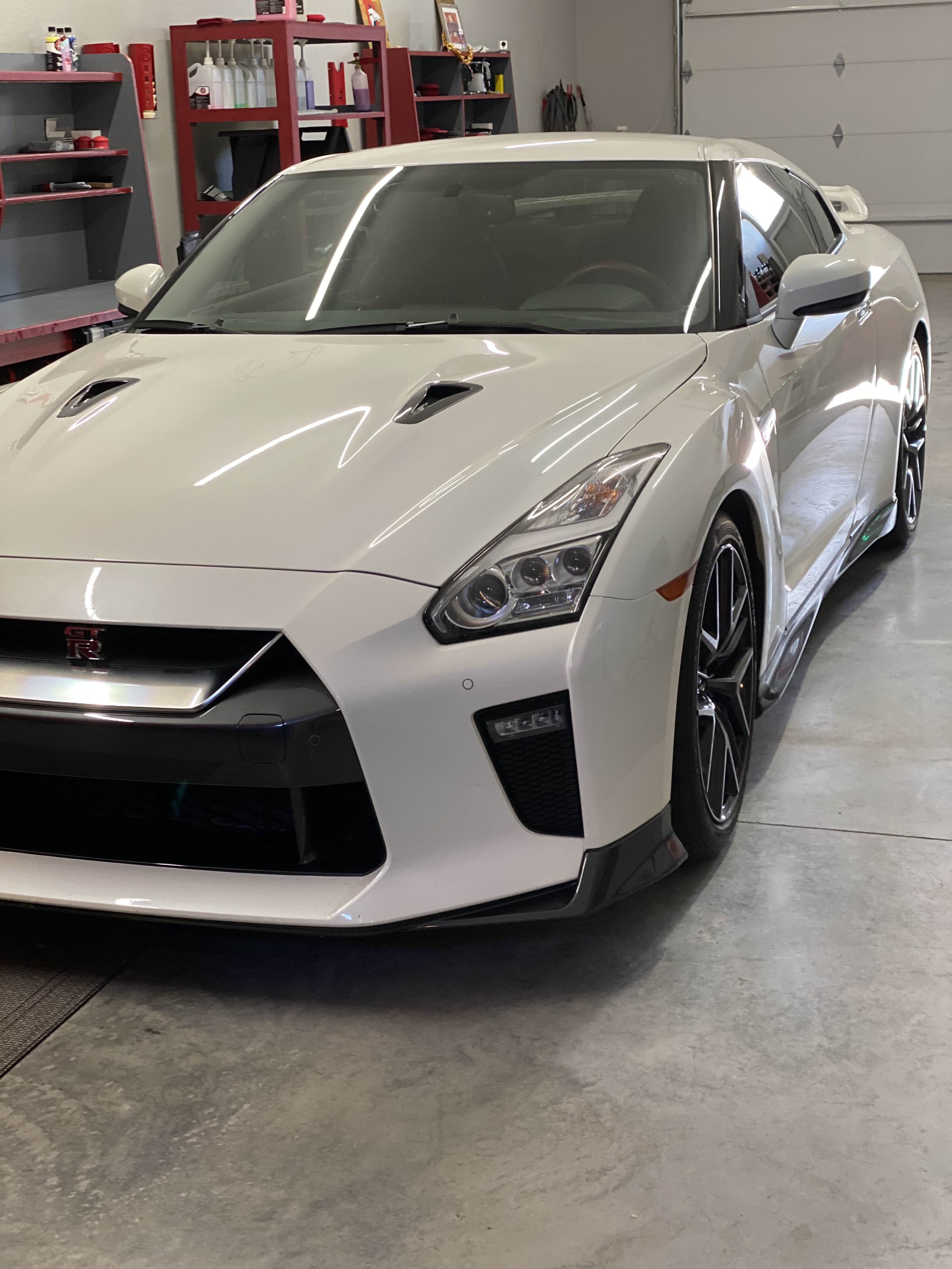 White Nissan GT-R in professional workshop